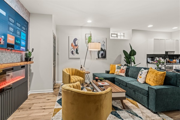 Kick back with your favorite show — this vibrant lounge was designed for comfort, connection, and fun.