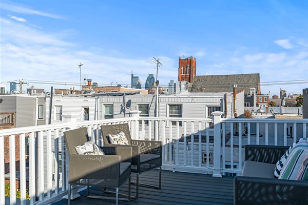 Unwind above the city—grab a drink, sink into the chairs, and enjoy the Philly skyline right from your private deck.