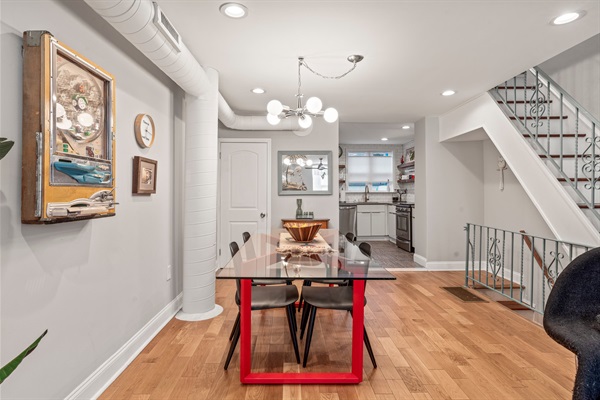 Gather at the bold dining table for home-cooked meals, work sessions, or long chats over coffee.