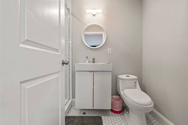 Bright ensuite bath with clean lines and a spa feel—fresh towels, sleek design, and everything you need.
