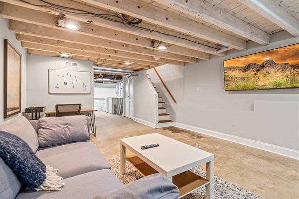 The finished basement offers a cozy spot to watch TV, work, or play games