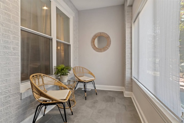 Enjoy your morning coffee or a quiet evening with a book on the charming enclosed patio. This cozy space is perfect for soaking in the natural light and unwinding after a busy day.