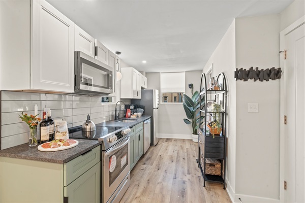 Cook in style with quartz counters, modern cabinetry, and everything you need for an easy Philly stay.