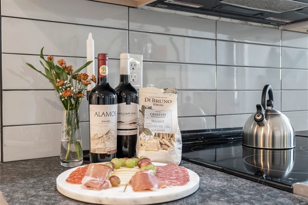 Local flavor meets style—wine, charcuterie, and cozy vibes set the tone for your perfect night in.