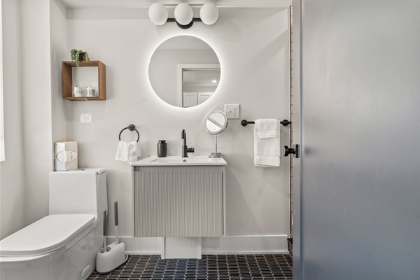 A spa-like bathroom with modern matte black fixtures and soft lighting for your morning routine.
